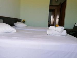 Postel nebo postele na pokoji v ubytování HOTEL ALEXANDROS