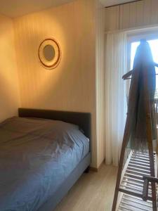 a bedroom with a bed and a window at Clair Vue A3 near Télécabine by Jolidi in Nendaz