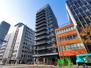 a group of tall buildings in a city at HOTEL LiVEMAX Shinsaibashi East in Osaka