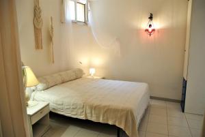 Postel nebo postele na pokoji v ubytování Ancoretta cottage between sea and nature