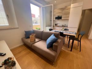 a living room with a couch and a table at Happy Holiday Apartment in Cagliari