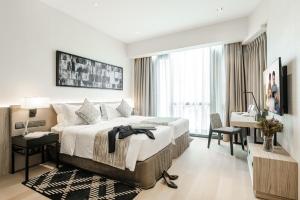 Postel nebo postele na pokoji v ubytování Ascott Star KLCC Kuala Lumpur
