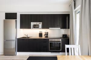 Dapur atau dapur kecil di Kotimaailma Apartments Loimu VII