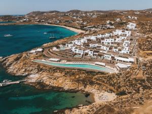 an aerial view of a resort next to the ocean at Cali Mykonos in Kalafatis