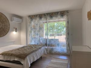Postel nebo postele na pokoji v ubytování T2 bord du canal du midi piscine