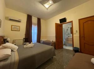 Postel nebo postele na pokoji v ubytování B&B Melibleo