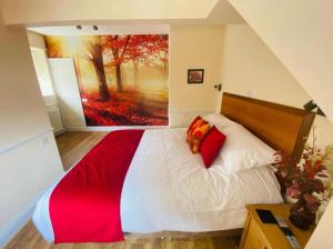 a bedroom with a large painting on the wall at All Seasons Bed & Breakfast - Adults Only in Weston-super-Mare