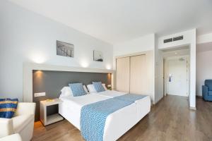 Postel nebo postele na pokoji v ubytování Hotel Vibra Beverly Playa
