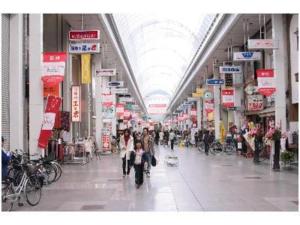 a group of people walking through a shopping mall at Bright Park Hotel - Vacation STAY 67836v in Kochi