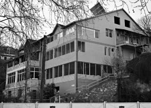 a large building with many windows on the side of it at Apartmani Kaldrma in Nov Dojran