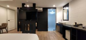 a bathroom with a sink and a counter top at Daon Hotel Gimhae Injae in Gimhae