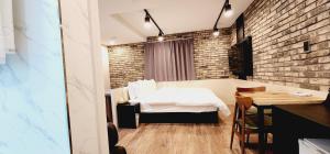 Giường trong phòng chung tại Daon Hotel Gimhae Injae