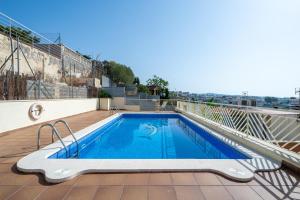 a swimming pool on the roof of a house at Villa Sabela in Segur de Calafell