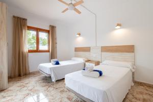A bed or beds in a room at Finca Bosc de Can Alou by Mallorca House Rent Még 22 kép