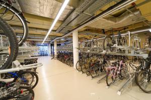 a large room filled with lots of bikes at Great apartment with view and heated rooftop Pool in Vienna
