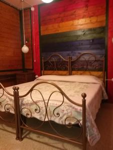 Een bed of bedden in een kamer bij Osteria dei Tratturi Rooms