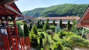 a view of a garden with trees and a building at Ati&Hanna in Praid