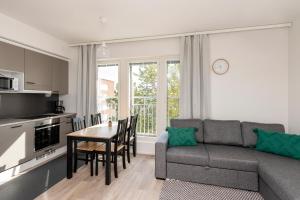 O bucătărie sau chicinetă la Kotimaailma Apartments Loimu V +1 fotografie