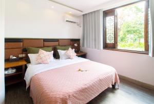 Alina Garden Boutique Resort Huangshan Hongcun客房内的一张或多张床位