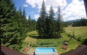 an aerial view of a backyard with a pool at House Apartments Jahorinko in Jahorina