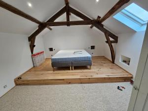 a bedroom with a bed in the middle of a room at Faites le plein de nature ! in Arbon +10 photos
