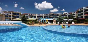 a large swimming pool with people in a resort at Riviera Complex 6 in Sveti Vlas