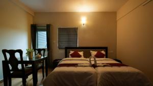 Oryx Home The Business Class Hotel客房内的一张或多张床位