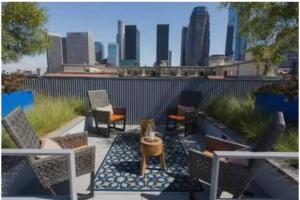 a patio with chairs and a table and a city skyline at Lovely 3bed Apt with pool close to SD Convetion Center 324 in San Diego