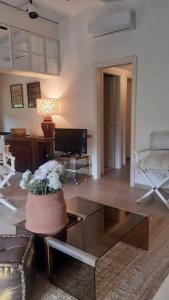 a living room with a coffee table and a couch at Villa Elisa in Punta Ala