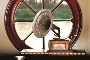 a fan sitting on a table in front of a window at Movenpick SS Misr Steamer Nile Cruise - 04 & 07 Nights Each Monday From Luxor and 03 Nights Each Friday from Aswan in Luxor