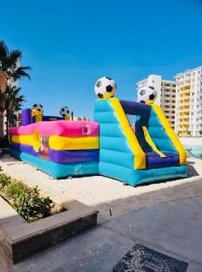 a play structure with a soccer ball on it at Sia Lagoon 2 BR Porto Golf Marina Apartment with Garden Families only in El Alamein
