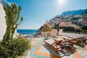 a view of a city from the roof of a house at Villa Petite Syrene by Elite Villas in Positano