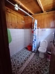 a bathroom with a toilet in a room at Dagdag Village Homestay - Sagada in Sagada
