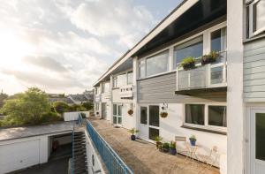 an exterior view of a house with a balcony at Number 4 - Stylish 1 bedroom house in Truro, Cornwall in Truro