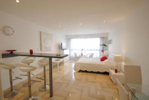 a bedroom with a bed and a desk in a room at Gray d Albion THI235 in Cannes