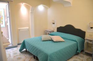 Postel nebo postele na pokoji v ubytování Villa Mimosa