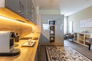 a kitchen with a counter with a coffee maker on it at Lake Side Luxury Steps To The Lake Lela - Happy Rentals in Balatonlelle