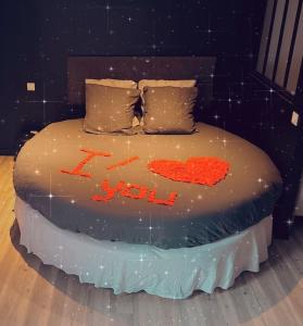 a cake with the word i love written on it at Appartement Love Room/Jacuzzi in Toulouse