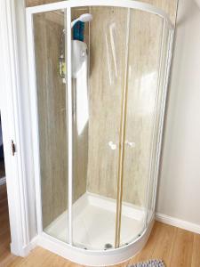 a shower with a glass enclosure in a room at Castlehill in Dundee