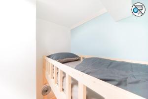 a bedroom with a bunk bed with a blue blanket at Shared dormitory Wan Chai Road 187 in Hong Kong