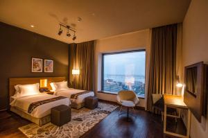 Ένα ή περισσότερα κρεβάτια σε δωμάτιο στο AltAir Boutique Hotel