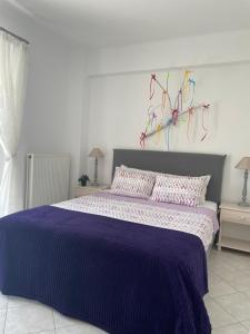 Postel nebo postele na pokoji v ubytování Pearl of Paralia Akrata