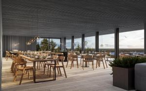 a dining room with tables and chairs and windows at Panorama Landscape Hotel in Nilsiä