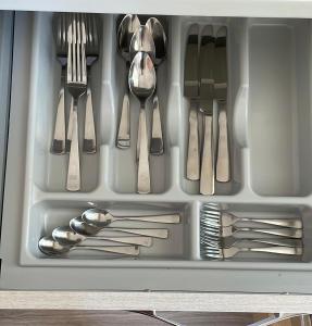a drawer filled with forks and spoons and utensils at AMA B&B in Montesilvano