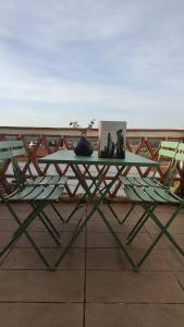 a green table with a book on top of it at La Cultureta in Segura de León