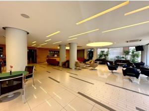 a large lobby with chairs and tables in a building at Hayali Suites in Jounieh