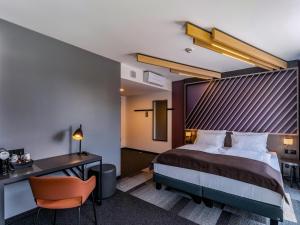 מיטה או מיטות בחדר ב-B&B Hotel Villingen-Schwenningen