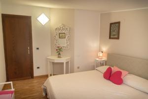 Postel nebo postele na pokoji v ubytování B&B Il Chiostro Assisi