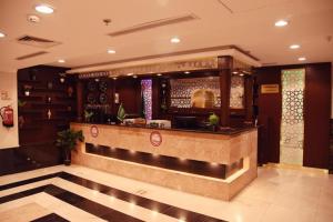 a lobby of a restaurant with a counter at Al Andlus Palace Hotel 2 in Al Madinah