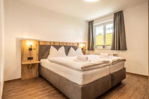 Postel nebo postele na pokoji v ubytování Alpha Apartments